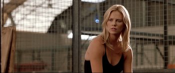 Movie still from “The Italian Job” (2003), directed by F. Gary Gray – Charlize theron in a scene from the movie; Close Up shot, Low angle