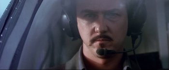 Movie still from “The Italian Job” (2003), directed by F. Gary Gray – A person wearing a headset; Close Up shot, Low angle
