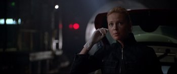 Movie still from “The Italian Job” (2003), directed by F. Gary Gray – A woman in black jacket holding a cell phone to her ear; Close Up shot, Low angle