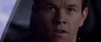Movie still from “The Italian Job” (2003), directed by F. Gary Gray – A man's face in a dark room; Close Up shot, Overhead angle