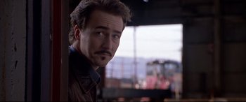 Movie still from “The Italian Job” (2003), directed by F. Gary Gray – A person with a mustache; Close Up shot, Low angle