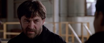 Movie still from “The Italian Job” (2003), directed by F. Gary Gray – A person wearing a black shirt; Close Up shot, Low angle