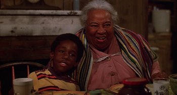 Movie still from “The Jerk” (1979), directed by Carl Reiner – An older woman sitting next to a young boy; Close Up shot, High angle
