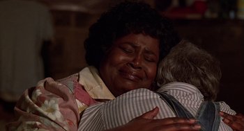 Movie still from “The Jerk” (1979), directed by Carl Reiner – An older woman is crying while hugging an older woman; Close Up shot, Low angle