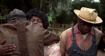 Movie still from “The Jerk” (1979), directed by Carl Reiner – An older man and a younger woman in a field; Medium shot, Over the shoulder angle