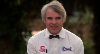 Movie still from “The Jerk” (1979), directed by Carl Reiner – A man in a white shirt and a bow tie; Close Up shot, Low angle