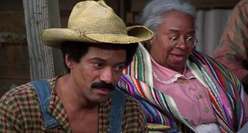 Movie still from “The Jerk” (1979), directed by Carl Reiner – An older woman and a younger man wearing hats; Close Up shot, High angle