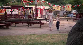Movie still from “The Jerk” (1979), directed by Carl Reiner – A woman and a little girl are in a park; Wide shot, High angle