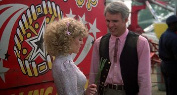 Movie still from “The Jerk” (1979), directed by Carl Reiner – A man and a woman standing next to each other; Medium shot, Over the shoulder angle