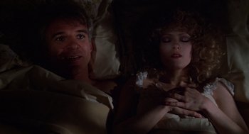 Movie still from “The Jerk” (1979), directed by Carl Reiner – A man and a woman laying in a bed together; Close Up shot, Overhead angle