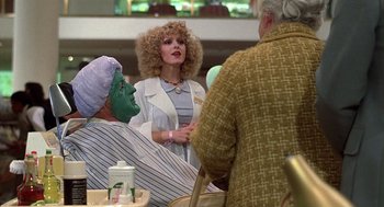Movie still from “The Jerk” (1979), directed by Carl Reiner – A woman in a wig talking to an older man; Medium shot, Over the shoulder angle