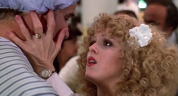 Movie still from “The Jerk” (1979), directed by Carl Reiner – A man and a woman are looking into each others eyes; Close Up shot, Over the shoulder angle