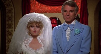 Movie still from “The Jerk” (1979), directed by Carl Reiner – A man and a woman dressed in wedding attire; Medium shot, Low angle