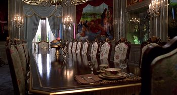 Movie still from “The Jerk” (1979), directed by Carl Reiner – A dining room table set for a meal with plates , glasses , silverware , and napkins on it; Wide shot, High angle