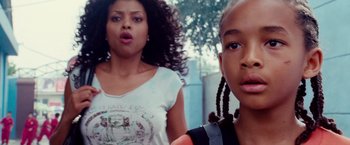 Movie still from “The Karate Kid” (2010), directed by Harald Zwart – A woman standing next to a young girl; Close Up shot, Low angle