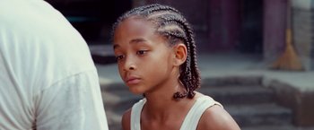 Movie still from “The Karate Kid” (2010), directed by Harald Zwart – A young person with braids; Close Up shot, High angle