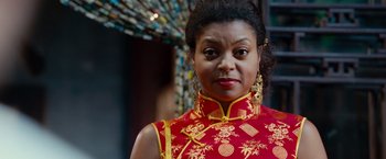 Movie still from “The Karate Kid” (2010), directed by Harald Zwart – A woman in a red and yellow dress; Close Up shot, Low angle