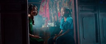 Movie still from “The Karate Kid” (2010), directed by Harald Zwart – Two people sitting in a room talking to each other; Medium shot, Over the shoulder angle