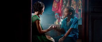 Movie still from “The Karate Kid” (2010), directed by Harald Zwart – Two people holding hands in front of each other; Medium shot, Over the shoulder angle