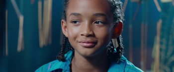 Movie still from “The Karate Kid” (2010), directed by Harald Zwart – A young person smiling for the camera; Close Up shot, High angle