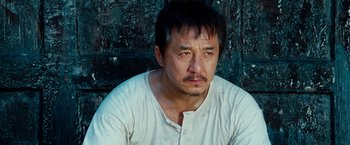 Movie still from “The Karate Kid” (2010), directed by Harald Zwart – A person wearing a white shirt; Close Up shot, High angle