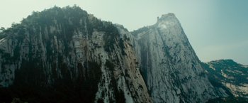 Movie still from “The Karate Kid” (2010), directed by Harald Zwart – A view of a mountain with a castle on top; Extreme Wide shot, High angle