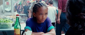 Movie still from “The Karate Kid” (2010), directed by Harald Zwart – A young boy sitting in front of a group of people; Close Up shot, High angle