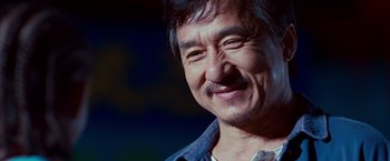 Movie still from “The Karate Kid” (2010), directed by Harald Zwart – A person smiling for the camera; Close Up shot, Low angle