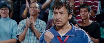 Movie still from “The Karate Kid” (2010), directed by Harald Zwart – A person wearing a blue jacket; Close Up shot, Low angle