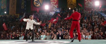 Movie still from “The Karate Kid” (2010), directed by Harald Zwart – Two men are fighting in front of an audience; Wide shot, Over the shoulder angle