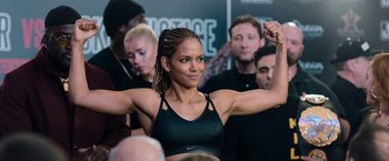 A woman that is showing off her muscles