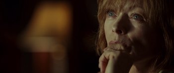 Movie still from “The Kingdom” (2007), directed by Peter Berg – A woman's face with blue eyes; Close Up shot, Over the shoulder angle