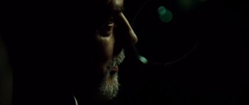 Movie still from “The Kingdom” (2007), directed by Peter Berg – A person with a beard; Extreme Close Up shot, Low angle