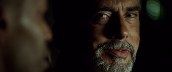 Movie still from “The Kingdom” (2007), directed by Peter Berg – A person with a beard; Extreme Close Up shot, Over the shoulder angle