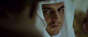 Movie still from “The Kingdom” (2007), directed by Peter Berg – A man's face with a white sheet covering his face; Close Up shot, Over the shoulder angle