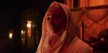A woman with a veil on her head