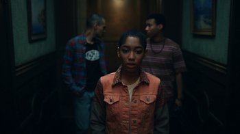 Movie still from “The Midnight Club” (2022), created by Mike Flanagan – A group of young men standing next to each other in a hallway; Medium shot, High angle