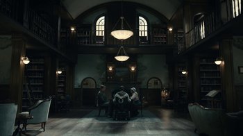 Movie still from “The Midnight Club” (2022), created by Mike Flanagan – A group of people sitting at a table in a room; Extreme Wide shot, High angle