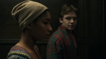 Movie still from “The Midnight Club” (2022), created by Mike Flanagan – A man and a woman standing next to each other; Close Up shot, Over the shoulder angle