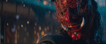 Movie still from “Bullet Train” (2022), directed by David Leitch – View of a red demon mask; Close Up shot, Low angle