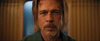 Movie still from “Bullet Train” (2022), directed by David Leitch – A person with long hair; Close Up shot, Low angle