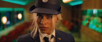 Movie still from “Bullet Train” (2022), directed by David Leitch – A woman wearing a uniform and a hat; Close Up shot, Low angle