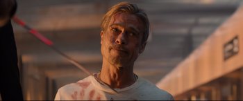 Movie still from “Bullet Train” (2022), directed by David Leitch – A person wearing a shirt; Close Up shot, Over the shoulder angle