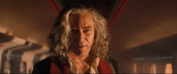 Movie still from “Bullet Train” (2022), directed by David Leitch – A person with long white hair; Close Up shot, Low angle