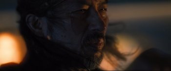 Movie still from “Bullet Train” (2022), directed by David Leitch – A person with a beard; Extreme Close Up shot, Over the shoulder angle
