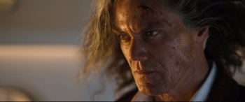 Movie still from “Bullet Train” (2022), directed by David Leitch – A person with long blonde hair; Close Up shot, Low angle