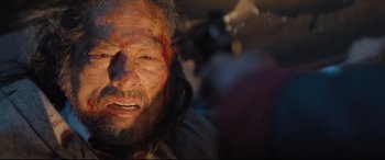 Movie still from “Bullet Train” (2022), directed by David Leitch – A person with blood on his face; Close Up shot, High angle