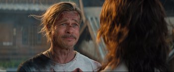 Movie still from “Bullet Train” (2022), directed by David Leitch – A man looking into a mirror while holding a woman's hand; Close Up shot, Over the shoulder angle