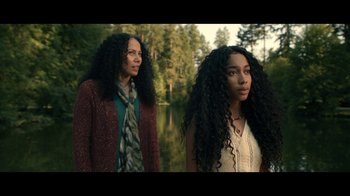 Movie still from “The Midnight Club” (2022), created by Mike Flanagan – Two women standing next to each other near a body of water; Medium shot, Low angle