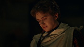 Movie still from “The Midnight Club” (2022), created by Mike Flanagan – A young man is looking down at his face; Close Up shot, Over the shoulder angle